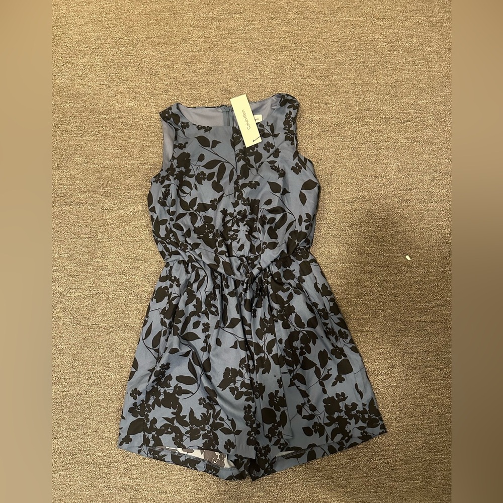 Calvin Klein Light Blue Romper with Black Floral Motif